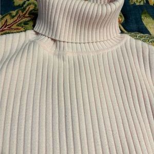 Soft pink, ribbed turtleneck sweater